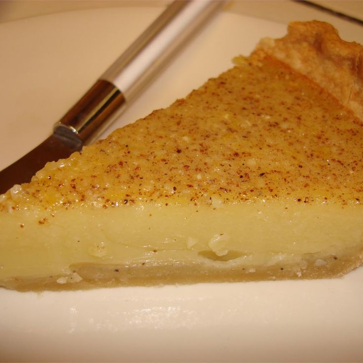 a piece of pie sitting on top of a white plate