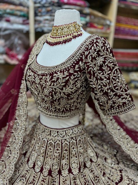 Burgundy enhance with pearl, crystal, sequins and jardozi work flared lehenga. Accomplished with similarly embroidered designer scoop neckline blouse and net dupatta. Fabric: Velvet Size: 38/M Occasion: Wedding Ceremony or Reception WASH CARE INSTRUCTIONS - Please Dry clean only when it is applicable. Slight color variation is possible due to digital photography. Ready to Ship! Custom designed according to client measurements and color preference. Production and delivery time is 120 days! Semi-stitched Stone Work Dupatta, Anarkali Dress With Stone Work And Traditional Drape, Festive Lehenga With Stone Work, Bollywood Dress With Stone Work For Reception, Semi-stitched Embellished Chinon Choli, Bollywood Style Dress With Stone Work For Reception, Bollywood Reception Dress With Stone Work, Designer Embellished Choli In Chinon, Elegant Stone Work Choli For Festivals