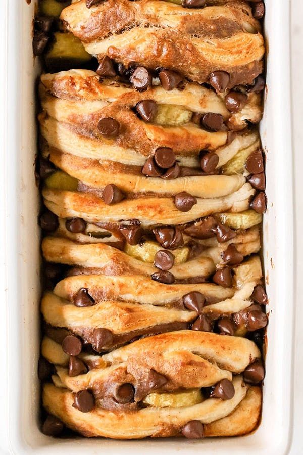 a casserole dish filled with bread and chocolate chips