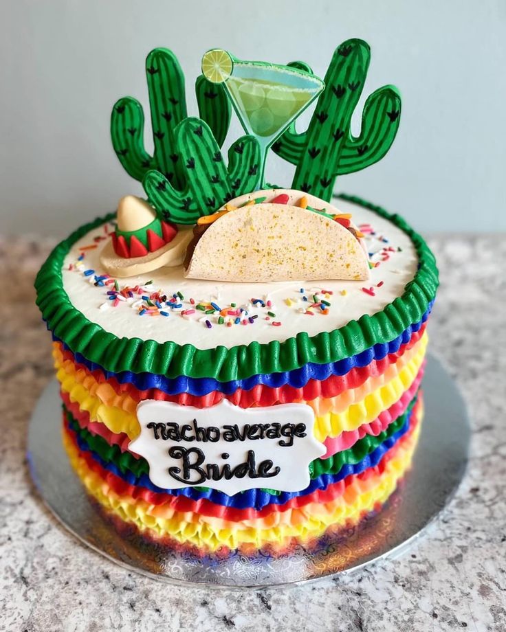 a cake decorated to look like a mexican themed desert with a margarita on top and a taco bar in the middle