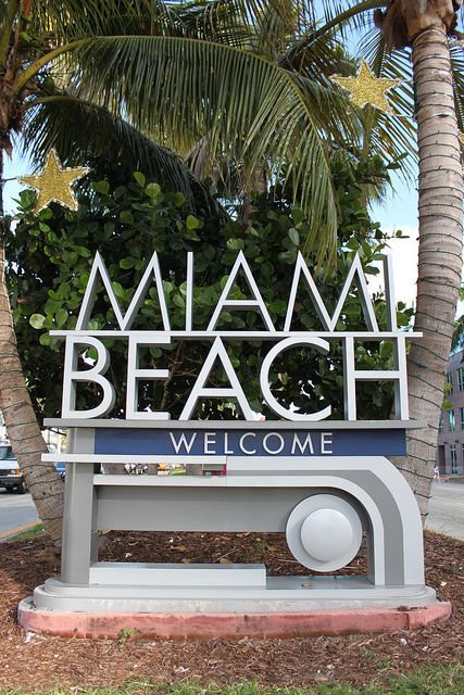 a sign that reads miami beach welcomes visitors