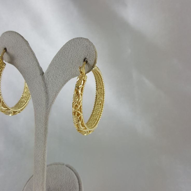 Elevate your style with these enchanting filigree earrings, designed to evoke admiration and elevate your festive looks, making them an ideal Christmas gift that exudes grace, elegance, and enduring beauty. 18K Gold Plated Floral Filigree Design Length: 40mm I 1.6 inch Width: 6mm I 0.2 inch , 13 grams Elegant Yellow Gold Hoop Earrings With Intricate Design, Formal Hoop Earrings With Intricate Design, Elegant Filigree Yellow Gold Hoop Earrings, Elegant Filigree Hoop Earrings As Gift, Ornate Gold Hoop Earrings For Gift, Gold Hoop Earrings With Elegant Design, Gold Hoop Earrings With Elegant Design For Anniversary, Elegant Gold Round Hoop Earrings, Elegant Gold Hoop Earrings For Festive Occasions