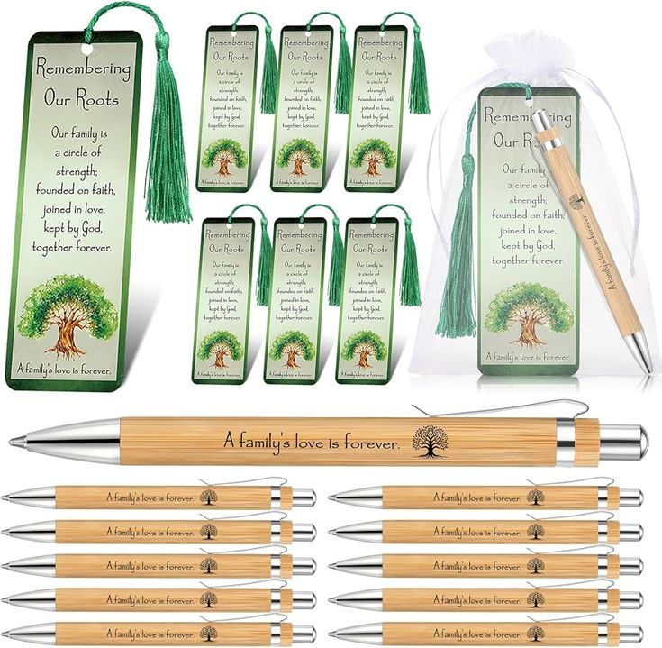 a set of six wooden pen and bookmarks with green tassels in front of them