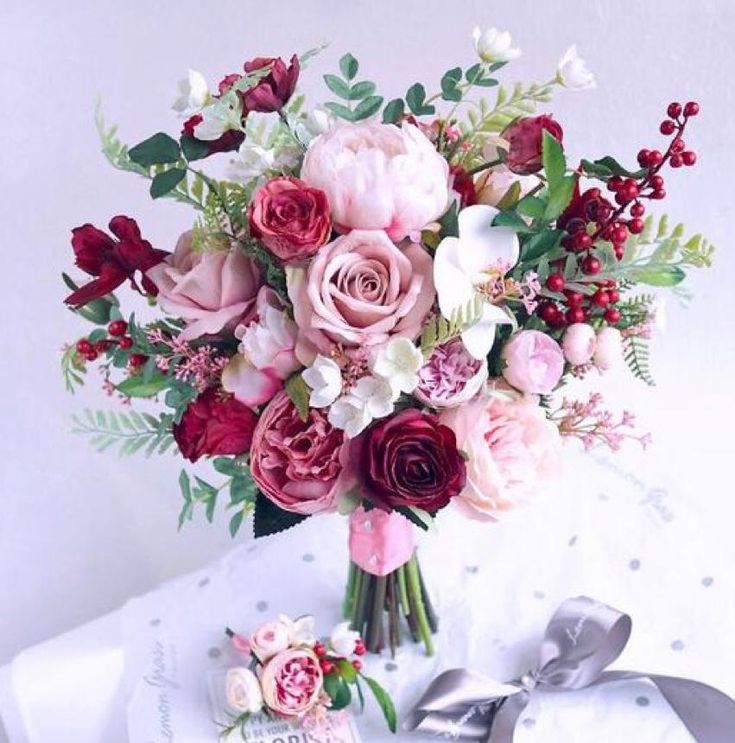 a bouquet of flowers sitting on top of a table