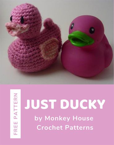 two crocheted rubber ducks sitting next to each other with the words just ducky written on them