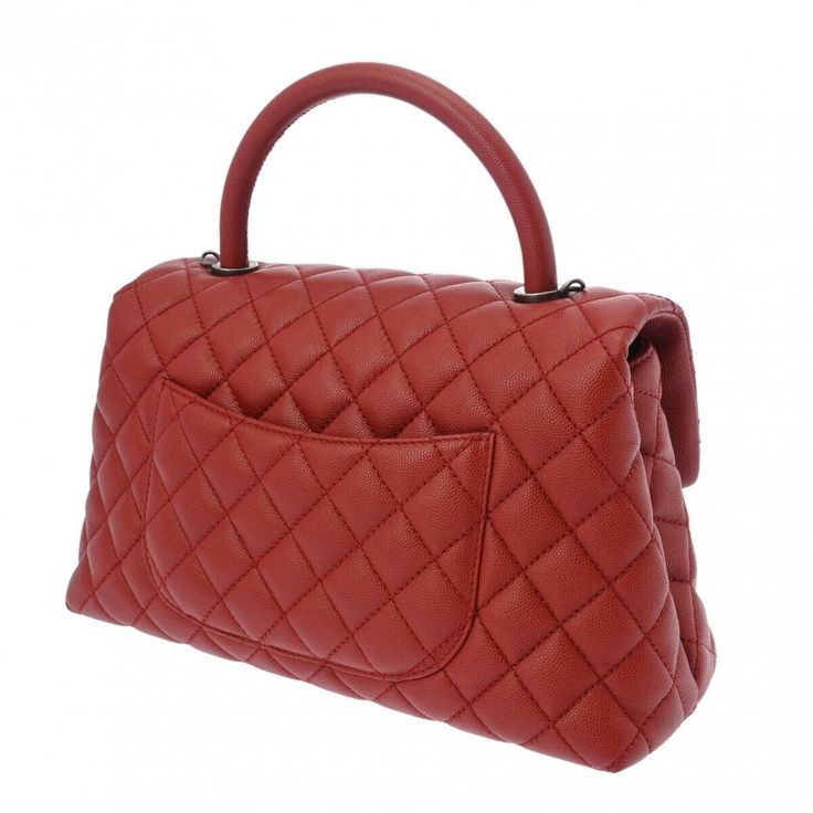 Introducing the Chanel Matrasse Top Handle 29 2Way Red Hand Bag, a timeless piece that effortlessly combines elegance and functionality. Crafted from high-quality red leather and featuring the iconic matrasse stitching, this bag exudes luxury and sophistication. The versatile design allows you to carry it by the top handle for a chic look or use the detachable strap for a more casual vibe.The spacious interior of the Chanel Matrasse Hand Bag provides ample room for all your essentials, making it Classic Quilted Bags For Formal Occasions, Classic Quilted Formal Bags, High-end Top Handle Bag With Cc Turnlock Closure, Luxury Satchel With Cc Turnlock Closure, Classic Quilted Flap Bag For Formal Occasions, Timeless Quilted Double Flap Bag, High-end Quilted Bags For Formal Occasions, High-end Quilted Formal Bag, Timeless Quilted Bag For Formal Occasions