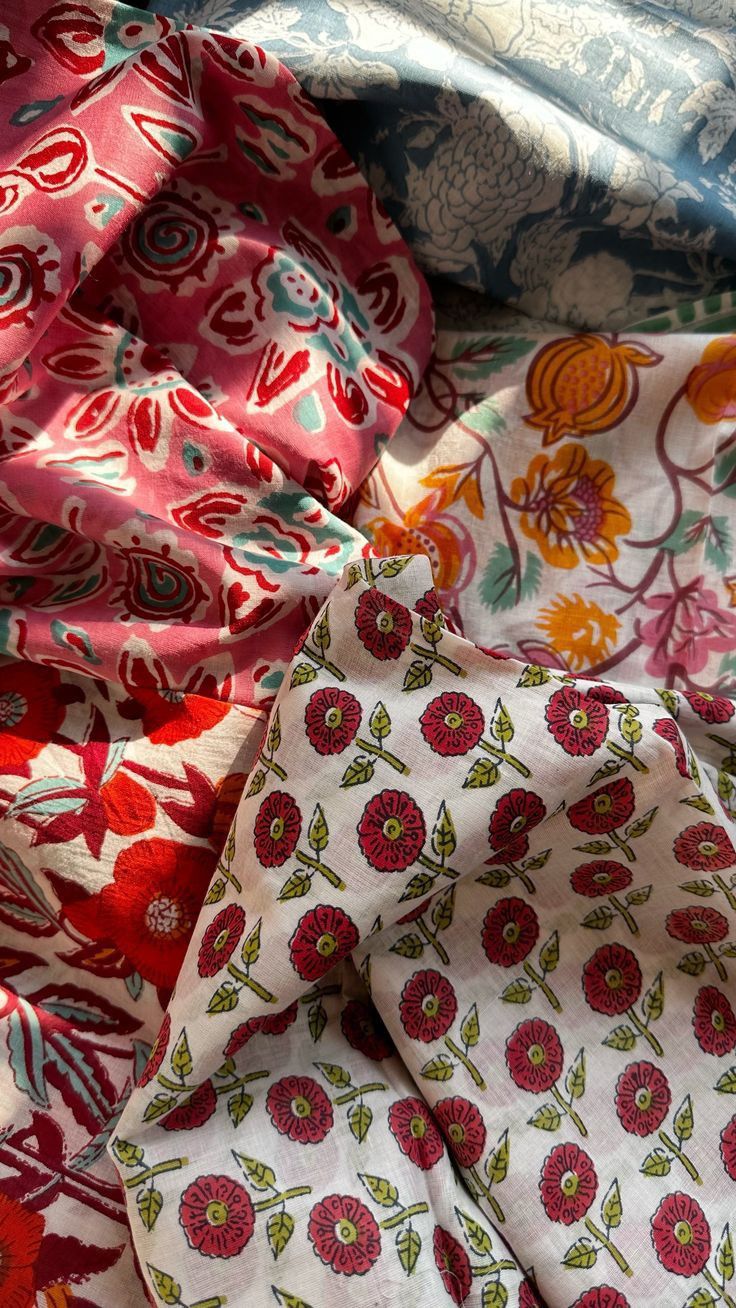 an assortment of different colored and patterned fabric