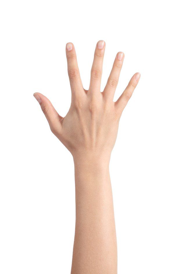 a person's hand reaching up into the air