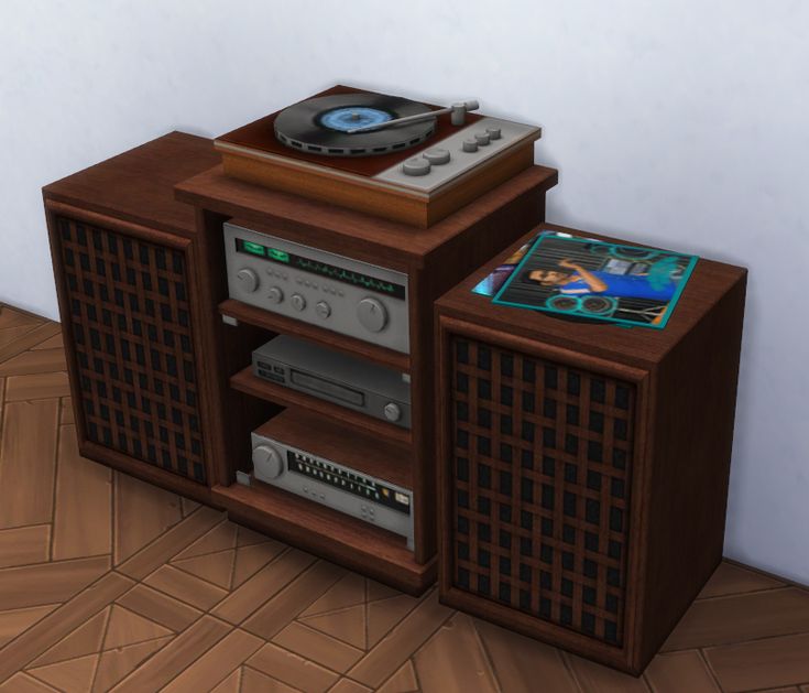 a record player sitting on top of a wooden cabinet next to a wall with a cd player