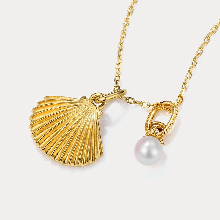 This delicate pearl and gold shell pendant necklace speaks volumes on sustainable style.  Featuring a genuine freshwater pearl nestled within a 9k gold-plated shell, this dainty necklace captures the ocean's essence in an eco-friendly design. Perfect for the conscious consumer, this necklace adds a touch of delicate charm and aquatic inspiration to any outfit. 🌊 DETAILS Plating: 9K Gold  Materials: 9K Gold on Silver, Freshwater Pearl Measurements: Length: 15.75 "(40cm) + Extender: 1.97"(5cm) Pendant Size: 0.47"*0.71"(1.2cm*1.8cm) Weight: 3.1 g Elegant Shell Pendant As A Gift, Elegant Shell Pendant As Gift, Elegant Shell Pendant For Gift, Shell Necklace With Pearl Pendant, Baroque Pearl Pendant Shell Necklace As Gift, Baroque Pearl Shell Necklace With Pendant As Gift, Elegant Gold Shell Necklace With Pearl Drop, Gold Pearl Shell Necklace With Pearl Drop, Shell-shaped Pearl Charm Necklace