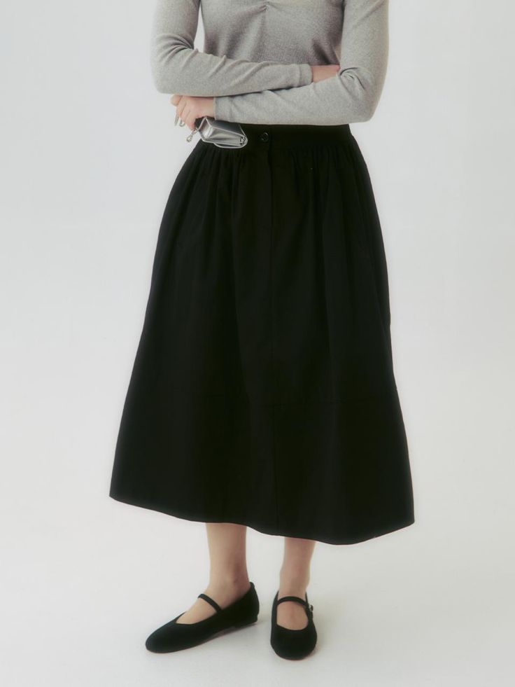 This product is a Button Flared Skirt, designed with a graceful flared silhouette that adds a touch of elegance and movement to the overall look. Its high-waist style accentuates the waistline, while the button details provide a classic and refined touch. This versatile skirt is suitable for both formal and casual settings, offering endless styling possibilities. - The skirt features a flared design that creates a sophisticated and feminine silhouette.- A series of buttons along the front add a vintage charm and visual interest.- Made from a smooth fabric, the skirt ensures comfort and a fluid drape.- Its versatile style pairs well with both fitted tops for a polished look and casual tees for a more relaxed outfit. Elegant Cotton Skirt With Button Closure, Chic Flowy Skirt With Button Closure, Full Skirt Bottoms With Buttons For Work, Chic Skirt With Button Closure For Daywear, Chic Flared Skirt Bottoms With Button Closure, Chic Flared Skirt Bottoms With Buttons, Elegant Skirt With Button Closure, Chic Long Skirt With Button Closure, Elegant Button Closure Flowy Skirt