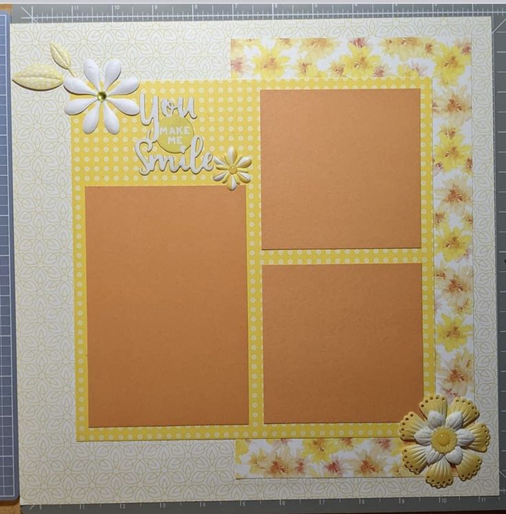 a scrapbook with yellow and white flowers on it