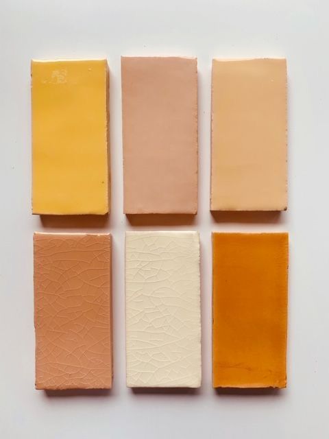 four different shades of paint sitting on top of each other