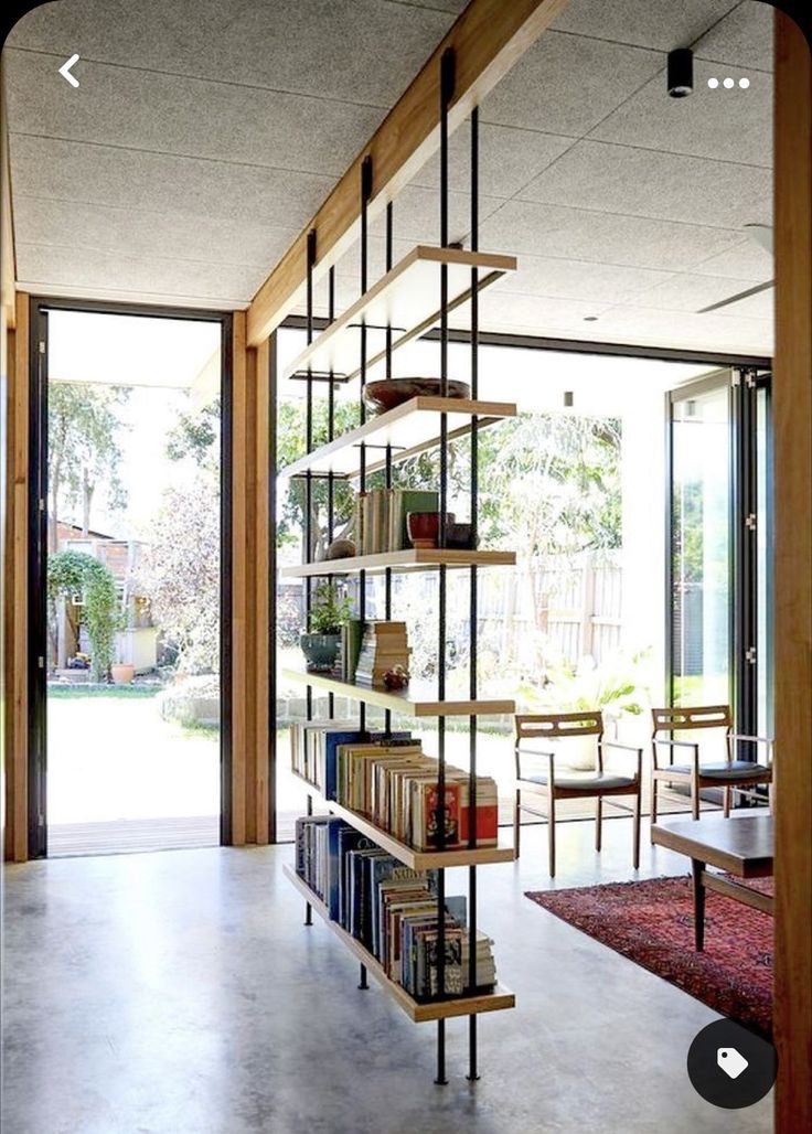 a book shelf in the middle of a room