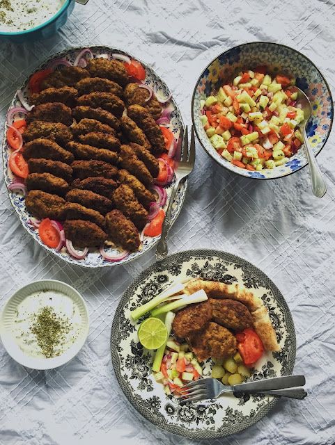 an assortment of food on plates and bowls