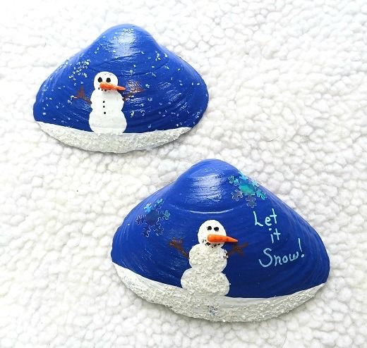 two painted rocks with snowmen on them