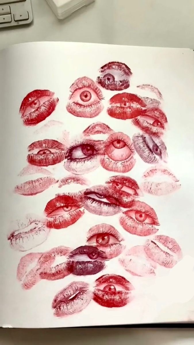 an open book with many different types of lips drawn in pencil on top of it