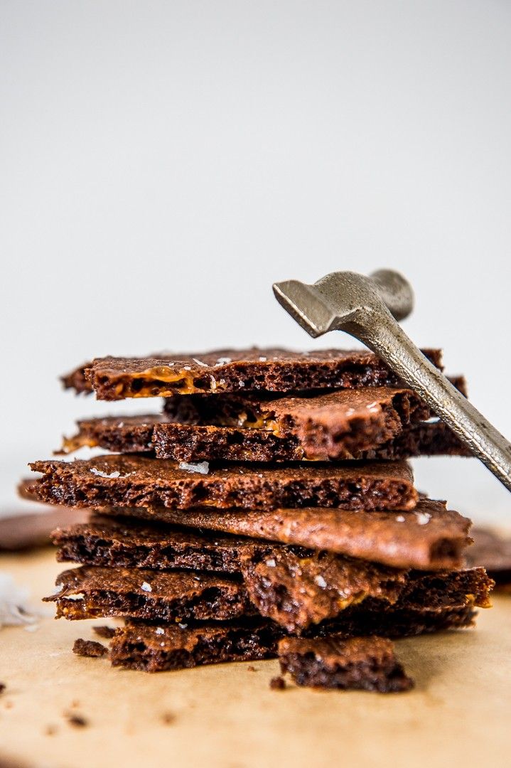 a stack of chocolate cookies with a wrench on top