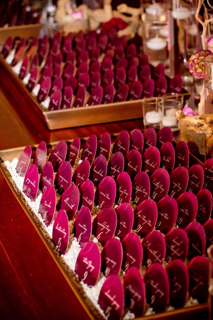 rows of red chairs with names on them