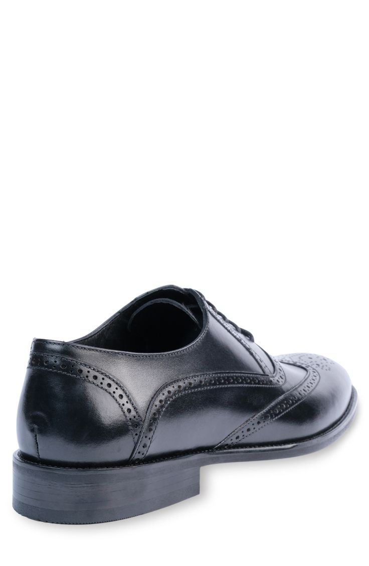 Handmade of smooth leather, this wingtip toe dress shoe with a classic oxford silhouette offers a sophisticated, elegant look. Leather upper and lining/synthetic sole Made in Turkey Classic Wingtip Oxford Shoes For Business, Classic Wingtip Oxford For Business, Classic Oxford Shoes With Brogue Detailing, Business Wingtip Oxford With Leather Sole, Wingtip Oxford With Leather Sole For Formal Occasions, Formal Wingtip Oxford With Leather Sole, Black Wingtip Lace-up Shoes For Formal Occasions, Business Wingtip Oxford Shoes With Goodyear Welt, Classic Brogue Detailed Oxford For Formal Occasions