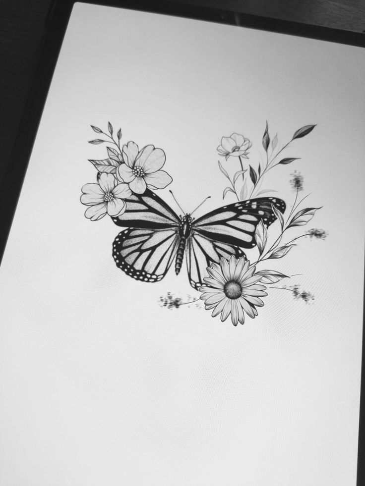 a black and white drawing of a butterfly with flowers