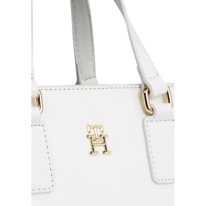 Brand: Tommy Hilfiger Gender: Women Type: Bags Season: Spring/Summer PRODUCT DETAIL • Color: white • Pattern: plain • Size (cm): 19x24x10 • Details: -handbag -with shoulder strap COMPOSITION AND MATERIAL • Composition: -100% polyurethane Chic White Satchel With Top Carry Handle, Trendy White Top Handle Shoulder Bag, Chic White Top Handle Bag, White Bags With Adjustable Strap And Double Handle, Chic White Satchel With Handles, White Double Handle Bag With Adjustable Strap, Chic White Bags With Double Handle, Trendy White Bags With Adjustable Strap, White Bag With Adjustable Strap For Everyday Use