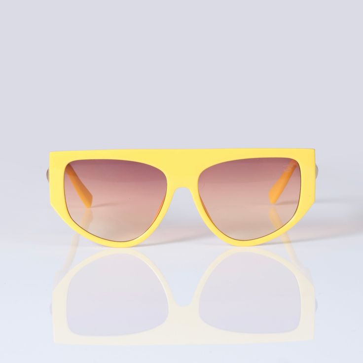 Ebullient adds a vivid pop of color and style to your look. Its eye-catching bright yellow frame, flat top, and gradient lens give you the versatility of a classic pair of shades and enough personality to stand out in any crowd. 100% UVA UVB protection Sizing Front Frame: 152 mm Lens width: 67 mm Bridge: 21 mm Casual Yellow Tinted Aviator Sunglasses, Casual Yellow Aviator Sunglasses With Tinted Lenses, Modern Yellow Cat Eye Sunglasses, Retro Yellow Tinted Aviator Sunglasses, Retro Yellow Aviator Sunglasses With Tinted Lenses, Yellow Tinted Plastic Sunglasses, Yellow Shield Sunglasses With Uv Protection For Summer, Yellow Tinted Aviator Sunglasses For Summer, Trendy Yellow Mirrored Shield Sunglasses