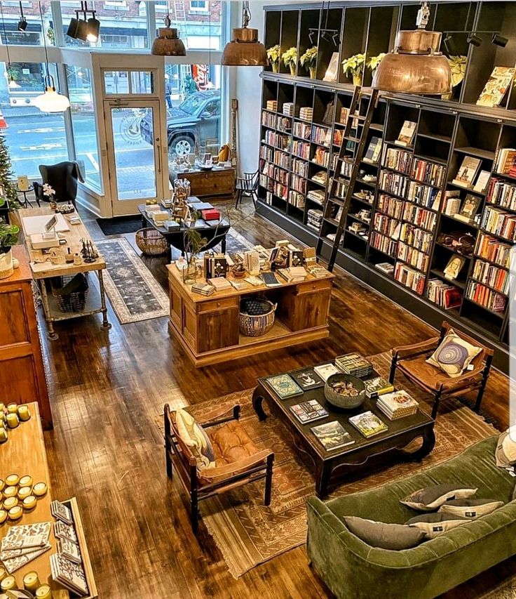 a living room filled with furniture and lots of books