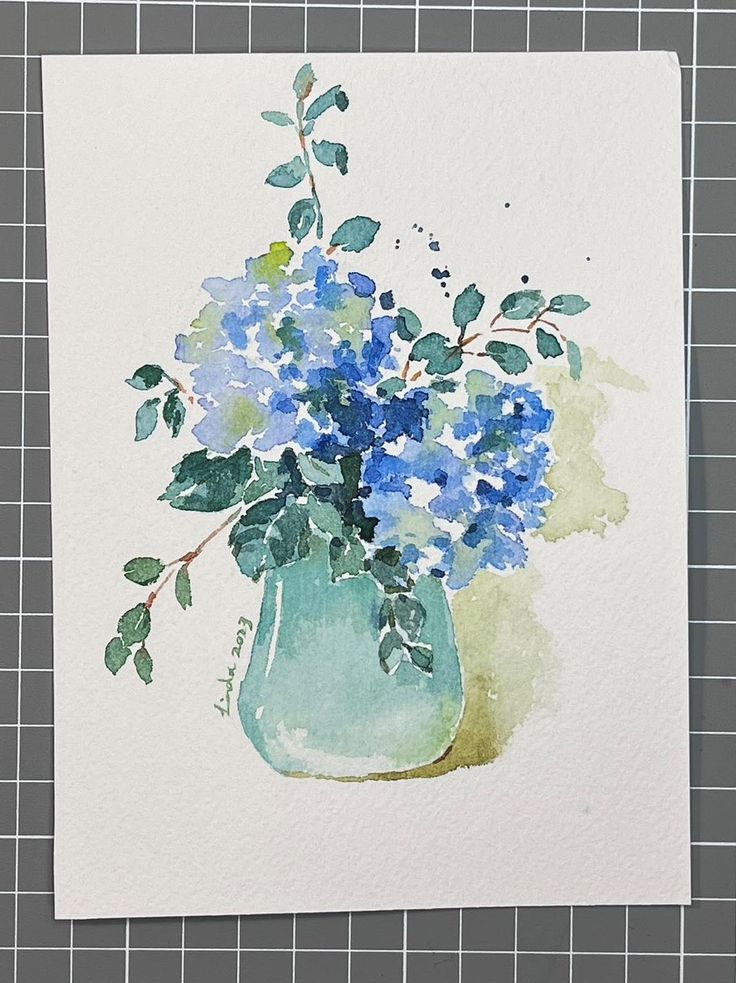 a watercolor painting of blue flowers in a green vase on a piece of paper