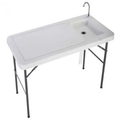 a white sink sitting on top of a table