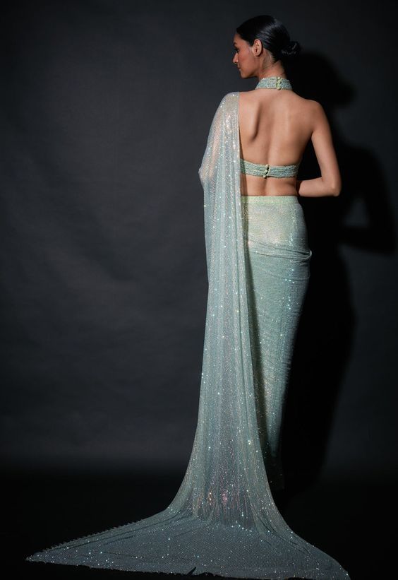 Editor's Note Featuring a pre-draped sari in refreshing shade of mint green paired with halter blouse Fabric: Net Color: Mint green Neckline: Halter Sleeve type: Sleeveless Component: Sari and ... Green Pre-draped Saree For Wedding, Green Georgette Draped Saree, Green Pre-draped Saree With Sheer Dupatta For Evening, Green Pre-draped Saree For Reception, Evening Green Blouse Piece With Sheer Dupatta, Green Blouse Piece For Evening With Traditional Drape, Green Draped Saree For Wedding, Elegant Draped Green Lehenga, Green Draped Saree With Unstitched Blouse