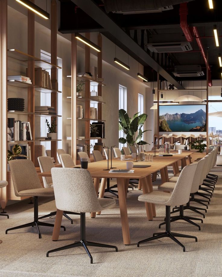 an empty conference room with tables and chairs