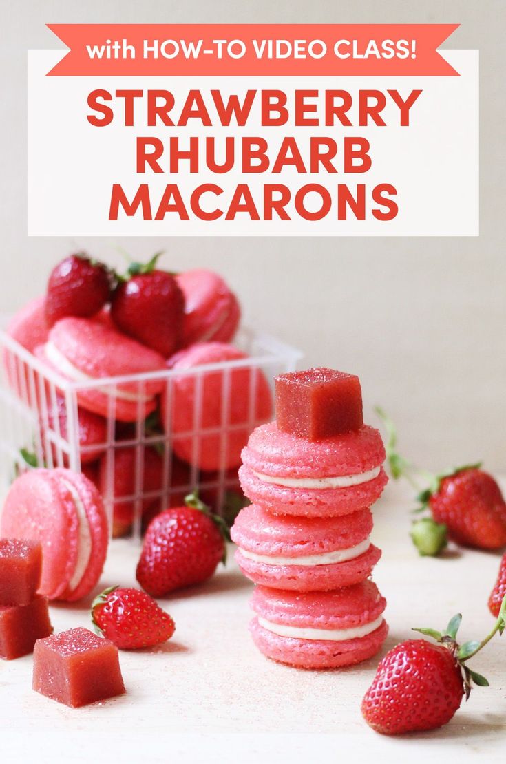 strawberry rhubarb macarons are stacked on top of each other with strawberries in the background