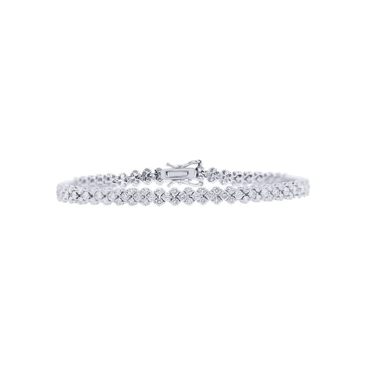 Add a touch of elegance and sophistication to your look with the Jagger Diamond Tennis Bracelet 3 5/8ct from Steven Singer Jewelers. This exquisite bracelet is crafted from 18-karat gold and features approximately 3 5/8 carats total weight of well-matched round brilliant diamonds. The diamonds are perfectly set to create a stunning tennis bracelet design that will elevate any outfit. The Jagger Diamond Tennis Bracelet is a true masterpiece from Steven Singer Jewelers, perfect for those who appre Diamond Tennis Bracelet, Bracelet Design, Tennis Bracelet Diamond, Top Gifts, Brilliant Diamond, Tennis Bracelet, Bracelet Designs, Round Brilliant, Everyday Look