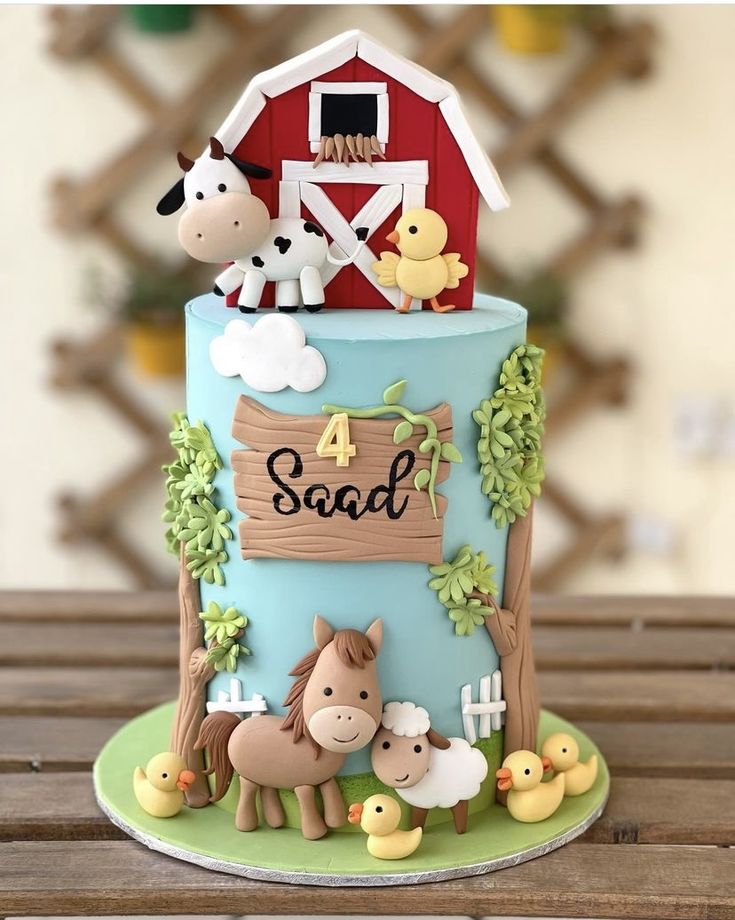 a birthday cake with farm animals on it