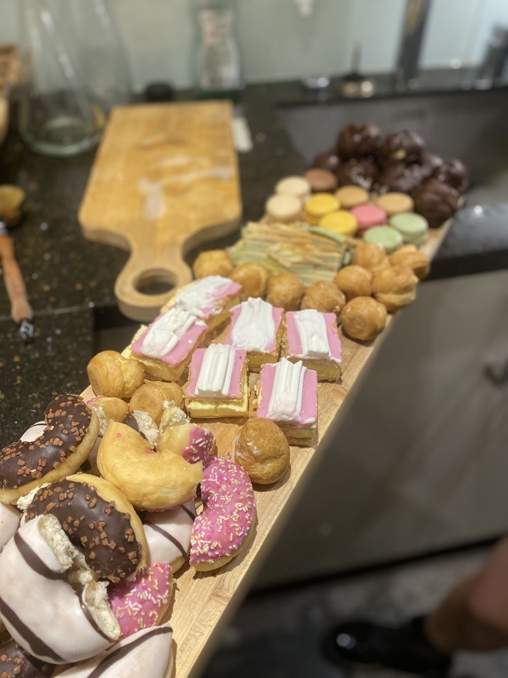 there are many different types of doughnuts on the table