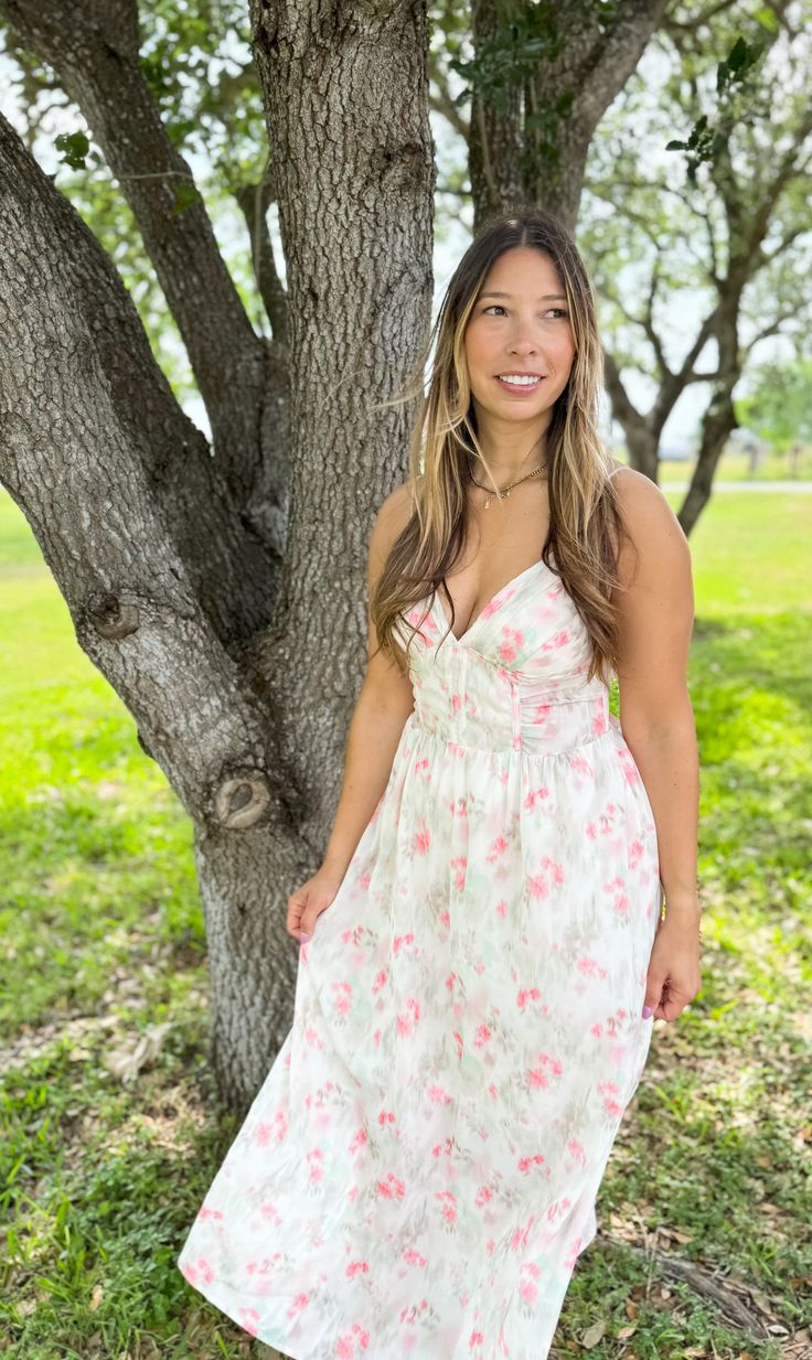 Are you looking for a versatile dress for every occasion this spring and summer?! If so, you're in the right place! This gorgeous watercolor printed dress is lightweight, yet heavy on the details...Pair her with a denim jacket for a little extra coverage, or a pair of wedges for a casual day. Maxi dress Color: off white with specs of pink/green/taupe Spaghetti straps [adjustable] Smocked at back Corset detail on front Lined [non-sheer] Material: 100% polyester Feminine Summer Floral Dress For Day Out, Spring Floral Dress For Garden Party, Feminine Floral Dress For Summer Day Out, Spring Garden Party Floral Dress, Spring Vacation Breezy Floral Dress, Breezy Spring Floral Dress For Vacation, Feminine Floral Dress For Spring Garden Party, Spring Vacation Dresses, Spring Dresses For Vacation