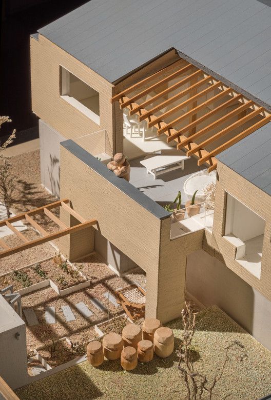 an aerial view of a house with wood slats on the roof