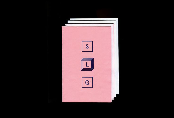 three pink notebooks stacked on top of each other