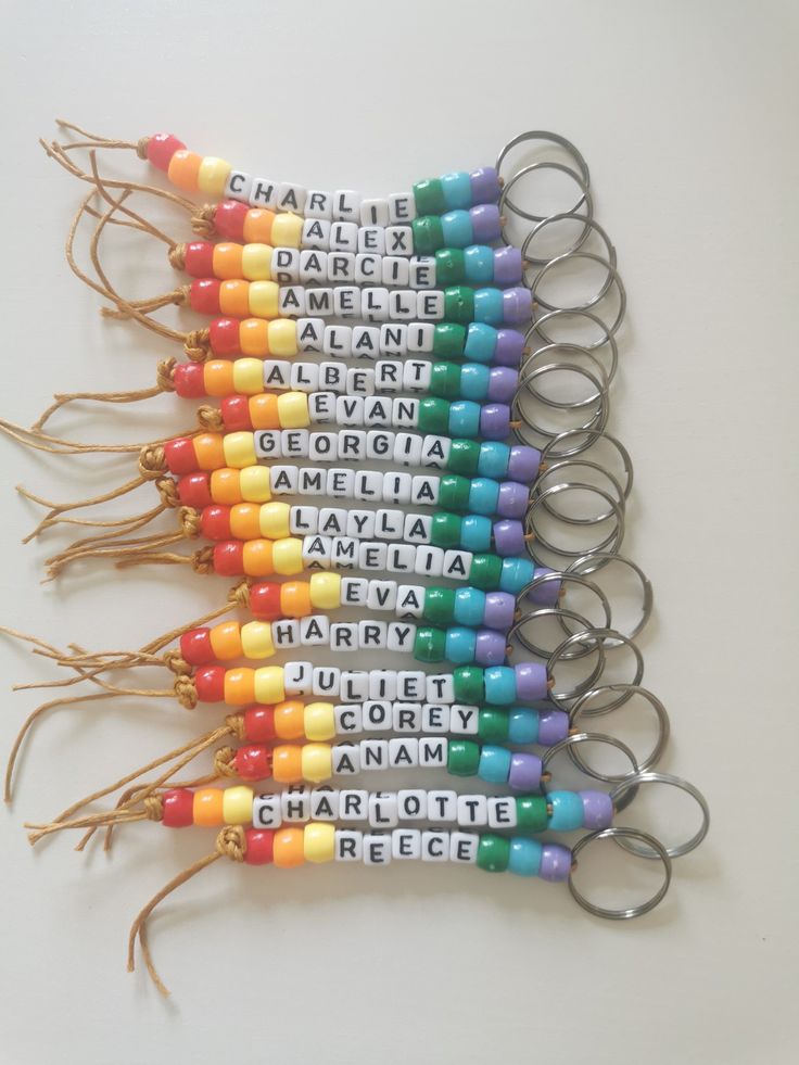 several pairs of rainbow colored keys with words written on them