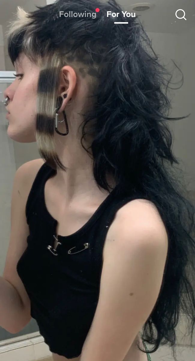 Long Black Hair With Undercut, Mohawk Undercut Women, Short At Front Long At Back Hair, Goth Dyed Hair Ideas, Punk Curly Haircut, Fluffy Mullet Shaved Sides, Long Mohawk Mullet, Side Shaved Mullet Women, V Bangs Mullet