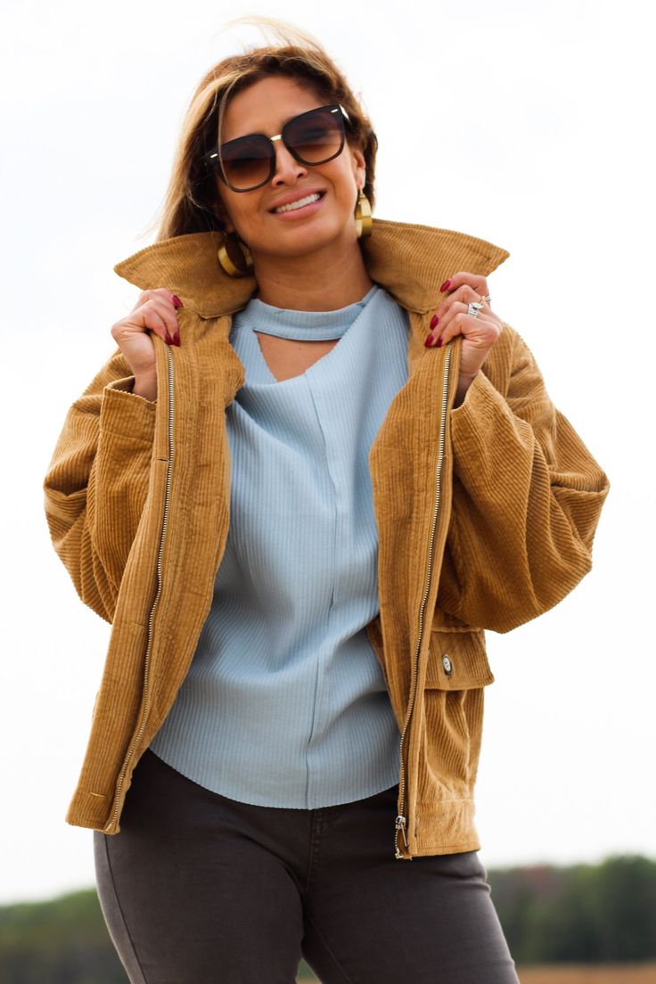 Complete any look with this stylish and comfortable jacket! -Color: Camel -Removable faux fur collared -Button down/ Zip up -Side flap pockets -Oversized silhouette -Content: 100% Cotton -Imported -Model is 5'5" 36-30-40 and wearing a size Small Spring Workwear Outerwear With Corduroy Collar, Trendy Winter Outerwear With Flap Pockets, Trendy Outerwear With Flap Pockets For Winter, Winter Utility Jacket With Corduroy Collar, Winter Utility Jacket With Corduroy Collar And Button-up, Winter Utility Jacket With Corduroy Collar Button-up, Fall Outerwear With Zipper Closure And Lapel Collar, Fall Corduroy Utility Jacket With Corduroy Collar, Brown Corduroy Outerwear With Corduroy Collar