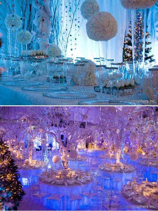 an image of a table set up for a wedding with blue lights and snow decorations