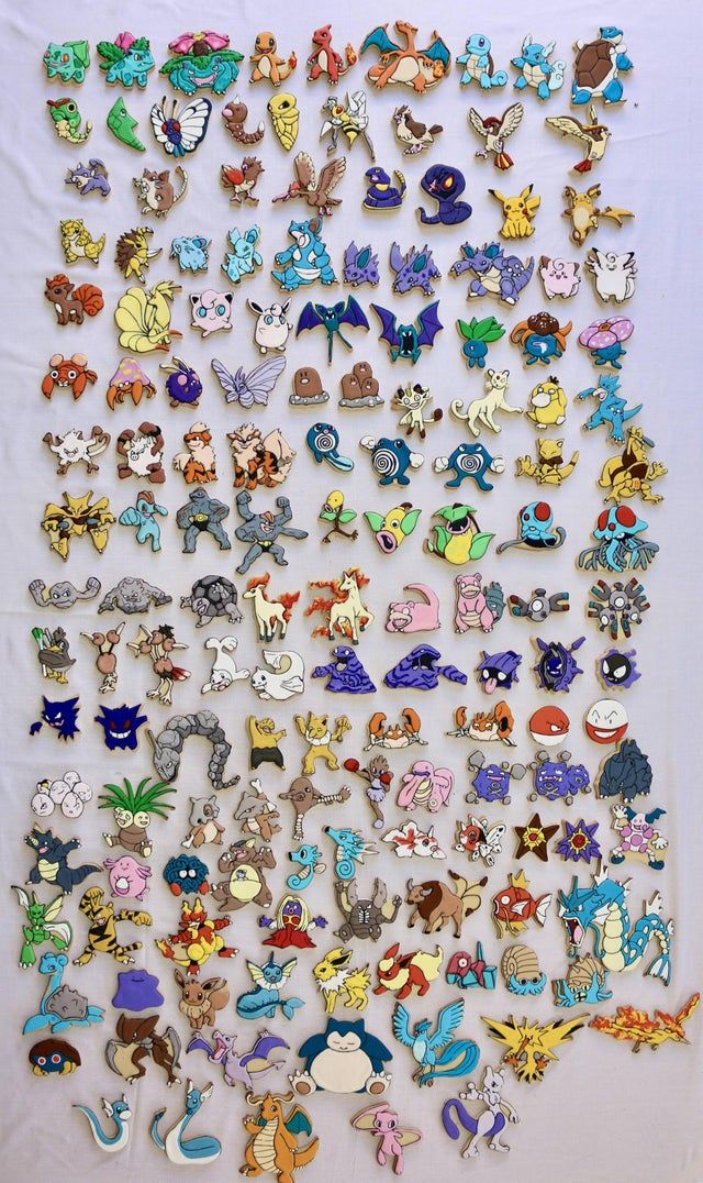 a large collection of pokemon pins and brooches