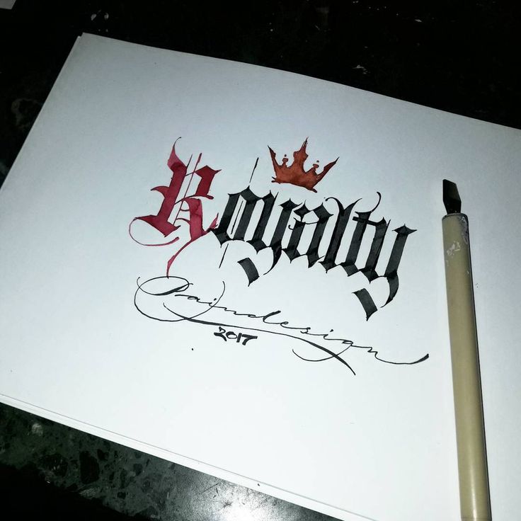 a pen and paper with the word fantasy written in cursive writing on it