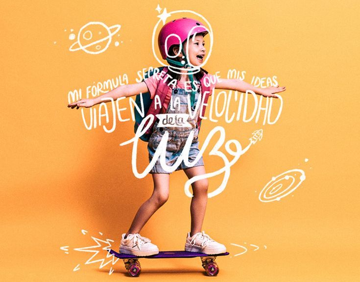 a young boy riding a skateboard on an orange background