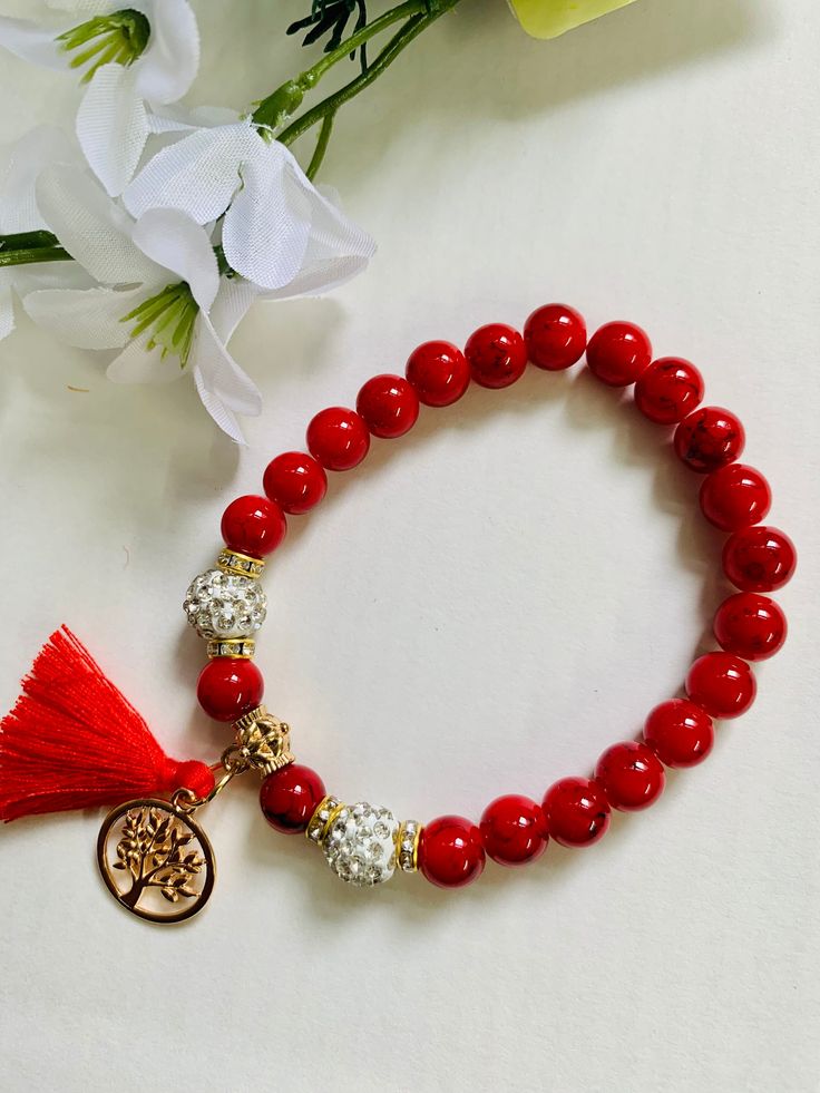 Beautiful handmade red glass bead bracelet with golden tassel charm with stretchable cord . size : fit for 7" to 8.5" inch wrist 1 piece  Color option Available Ready to ship with eco friendly packaging. Cheap Handmade Red Charm Bracelet, Red Spiritual Beaded Bracelets As Gift, Spiritual Red Beaded Bracelets As Gift, Spiritual Red Beaded Bracelets For Gift, Red Beaded Bracelets For Meditation 8mm, Red Beaded Charm Bracelet In Spiritual Style, Red Bracelets With 8mm Beads For Meditation, Red Meditation Bracelets With 8mm Beads, Spiritual Beaded Red Charm Bracelet