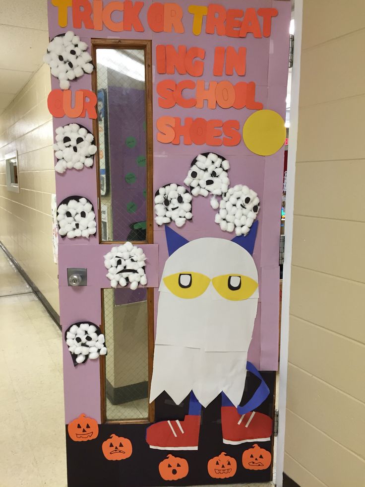 a door decorated to look like a trick or treat for the school's halloween decorations