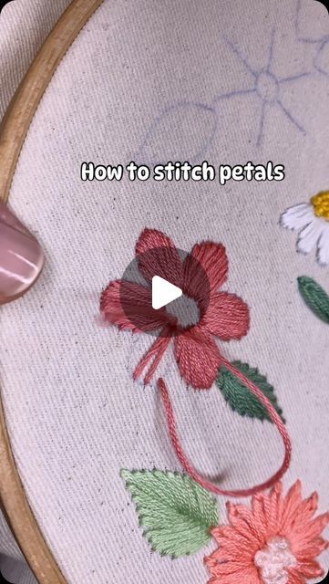 a close up of a embroidery on a hoop with the words how to stitch petals