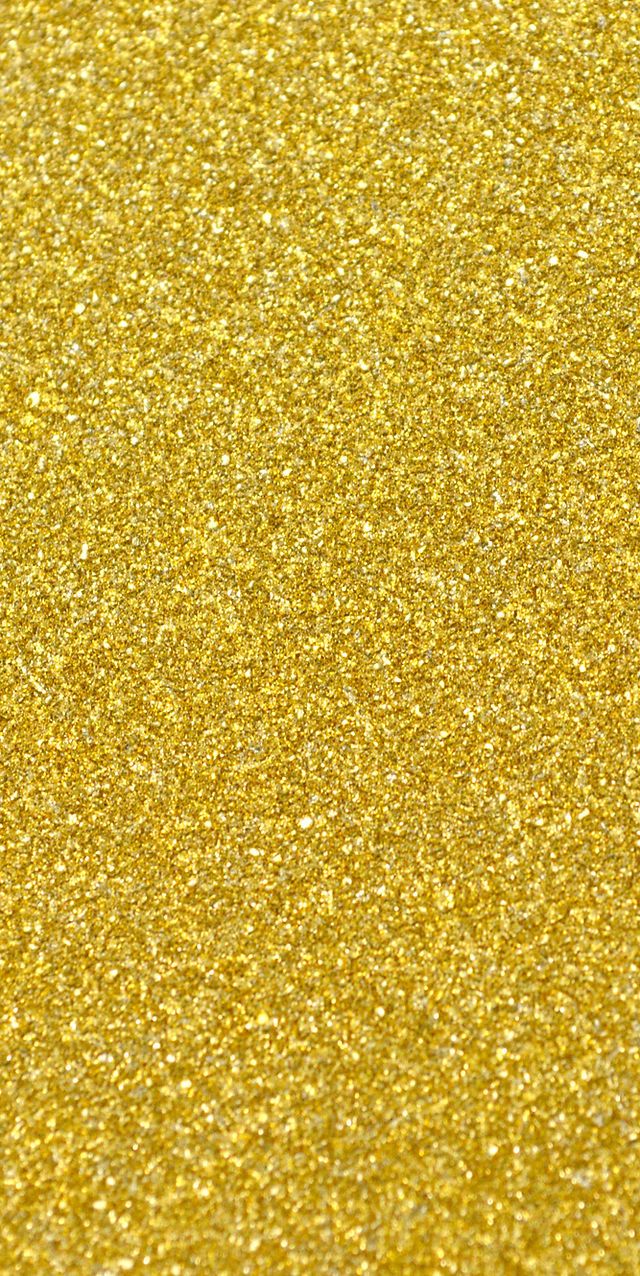 an airplane is flying in the sky with gold glitter